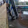 Bus hanging off bridge image