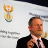 Minister Rob Davies cutting the ribbon to officially launch the Musina Intermodal Terminal. 